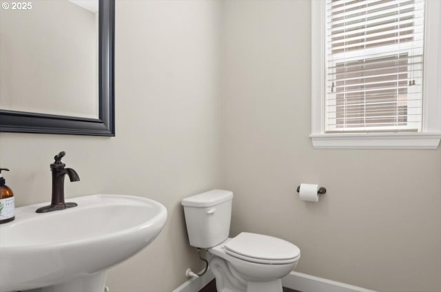 2964 NW Parkhurst Ter, Portland, OR 97229 - half bathroom featuring baseboards, a sink, and toilet