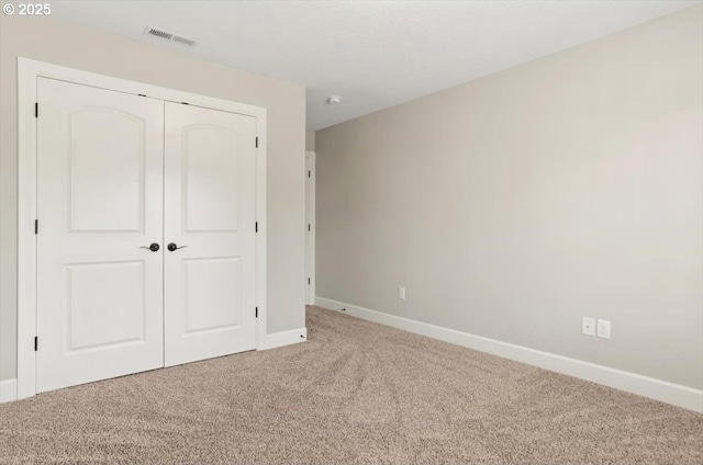 2964 NW Parkhurst Ter, Portland, OR 97229 - unfurnished bedroom featuring carpet floors, baseboards, and a closet