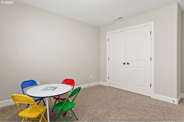 game room with carpet and baseboards