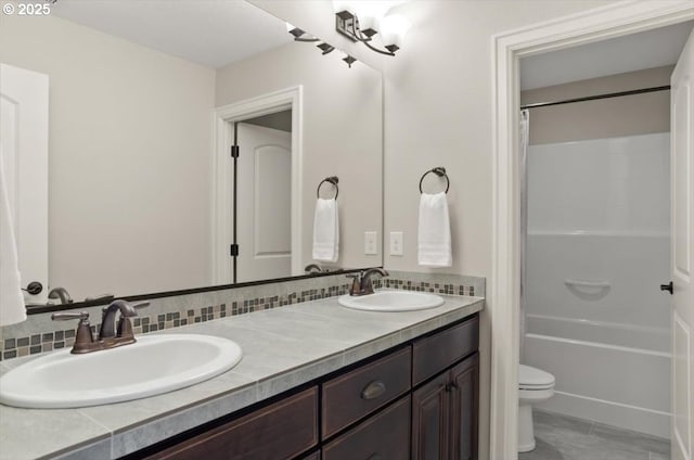 2964 NW Parkhurst Ter, Portland, OR 97229 - full bathroom with double vanity, toilet, shower / bath combo with shower curtain, and tile patterned floors