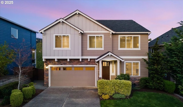 2964 NW Parkhurst Ter, Portland, OR 97229 - craftsman-style house with board and batten siding, an attached garage, concrete driveway, stone siding, and a shingled roof