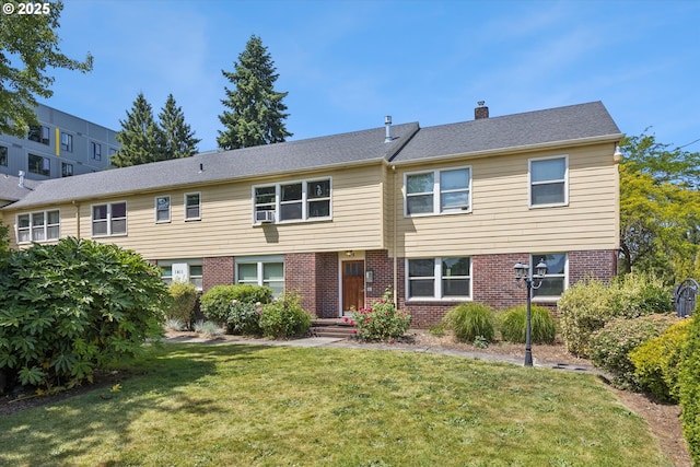 1411 N Alberta St Unit 1, Portland, OR 97035 - townhome / multi-family property with brick siding, a front yard, and a chimney