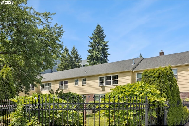 1411 N Alberta St Unit 1, Portland, OR 97035 - back of house featuring brick siding and a chimney