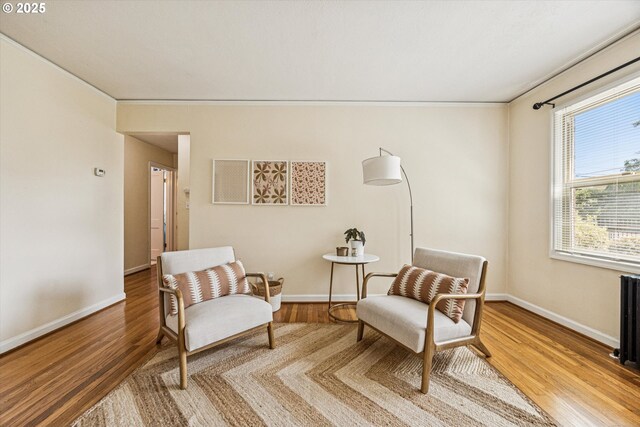 1411 N Alberta St Unit 1, Portland, OR 97035 - spare room featuring radiator heating unit and wood finished floors