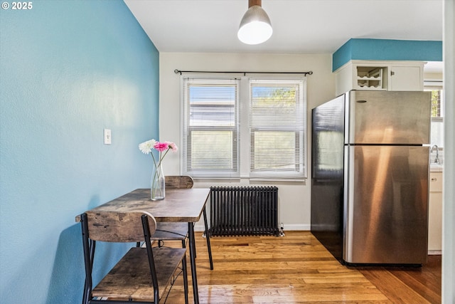 1411 N Alberta St Unit 1, Portland, OR 97035 - kitchen featuring stainless steel appliances, light countertops, white cabinets, and glass insert cabinets