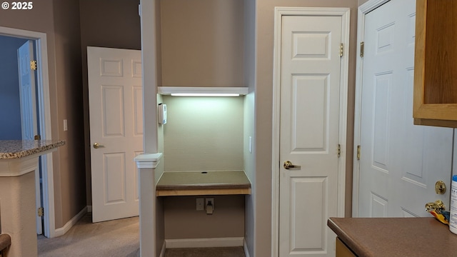 interior space featuring baseboards