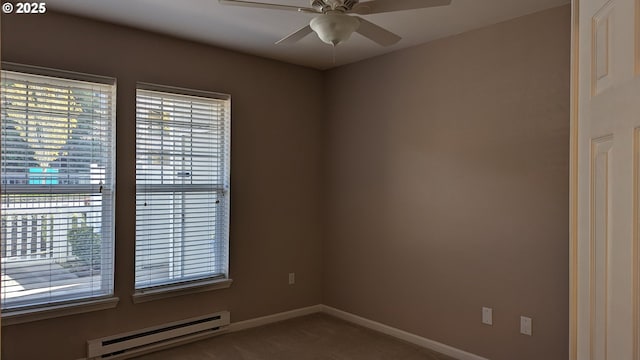 empty room featuring carpet floors, a ceiling fan, baseboards, and baseboard heating