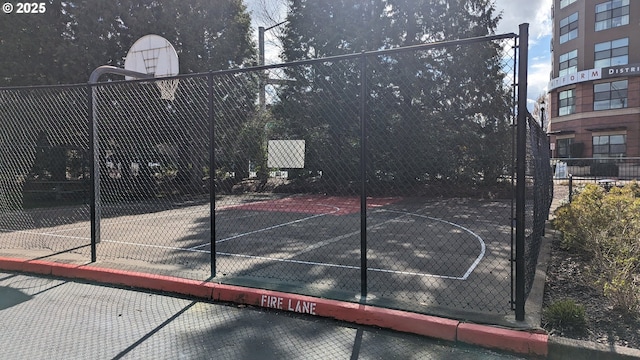 view of sport court featuring community basketball court and fence
