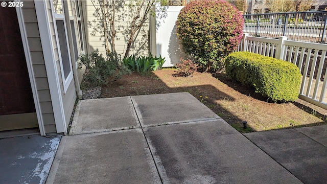 view of yard with a patio and fence