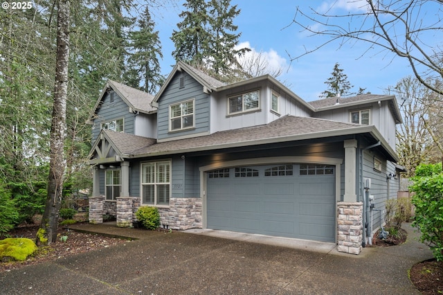 craftsman-style house featuring roof with shingles, a garage, stone siding, aphalt driveway, and board and batten siding