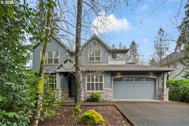 view of front of property with stone siding and driveway