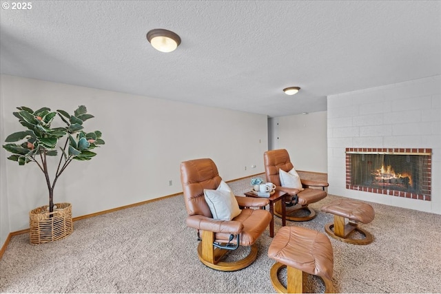 13807 NE Klickitat Ct, Portland, OR 97230 - living area featuring carpet, a textured ceiling, a fireplace, and baseboards