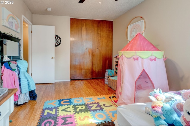 6097 SW Valley Ave, Beaverton, OR 97008 - recreation room featuring wood finished floors, a ceiling fan, and a textured ceiling