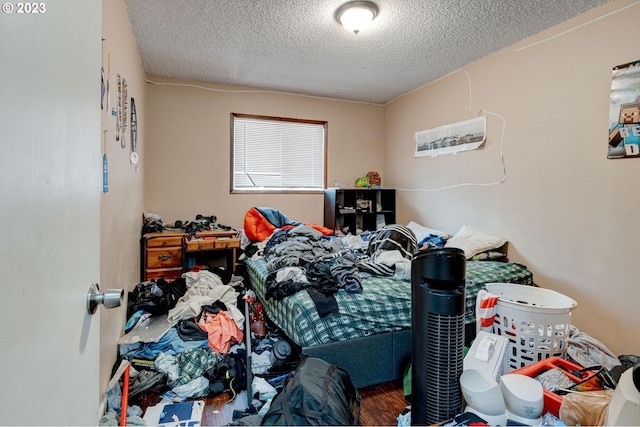 6097 SW Valley Ave, Beaverton, OR 97008 - bedroom with a textured ceiling and wood finished floors