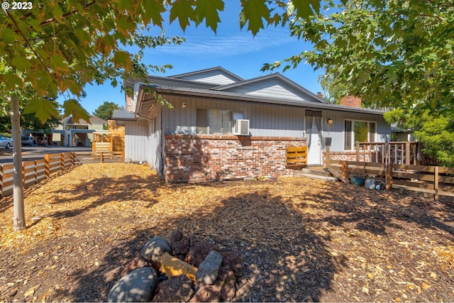 6097 SW Valley Ave, Beaverton, OR 97008 - ranch-style home with brick siding, a wooden deck, and cooling unit