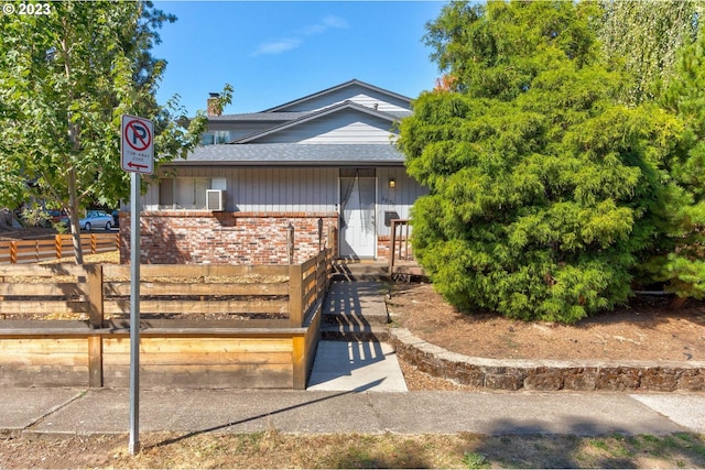6097 SW Valley Ave, Beaverton, OR 97008 - view of front facade with brick siding and roof with shingles