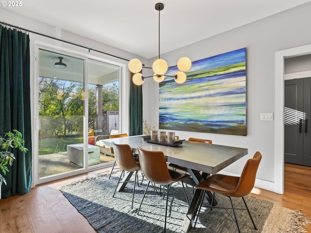 dining space with hardwood / wood-style floors