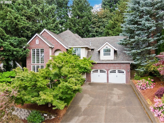 3533 Vista Ridge Dr, West Linn, OR 97068 - view of front of home featuring brick siding, a garage, driveway, and roof with shingles