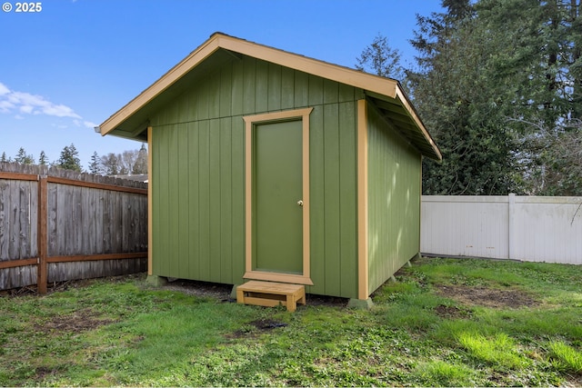 view of shed with a fenced backyard