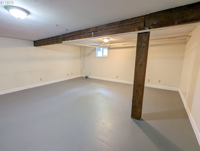 basement featuring baseboards