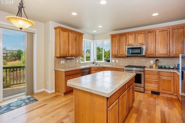 1761 S 18th Cir, Ridgefield, WA 98642 - kitchen with stainless steel appliances, light wood-type flooring, brown cabinets, and recessed lighting