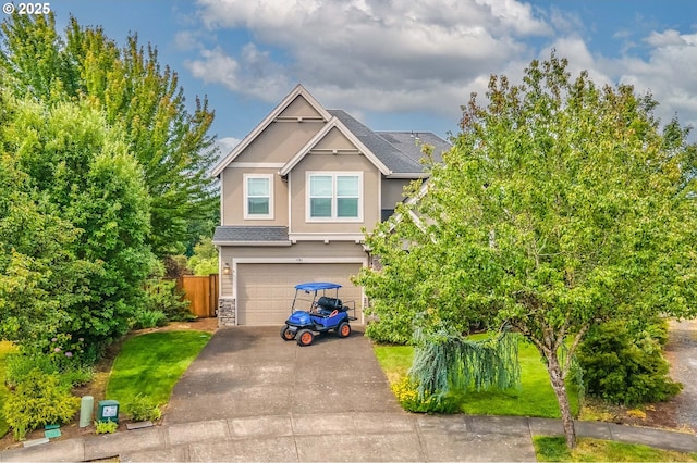 1761 S 18th Cir, Ridgefield, WA 98642 - view of front facade featuring asphalt driveway, a garage, stucco siding, stone siding, and a shingled roof