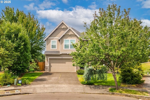 1761 S 18th Cir, Ridgefield, WA 98642 - view of front of house featuring a garage, concrete driveway, stone siding, and stucco siding