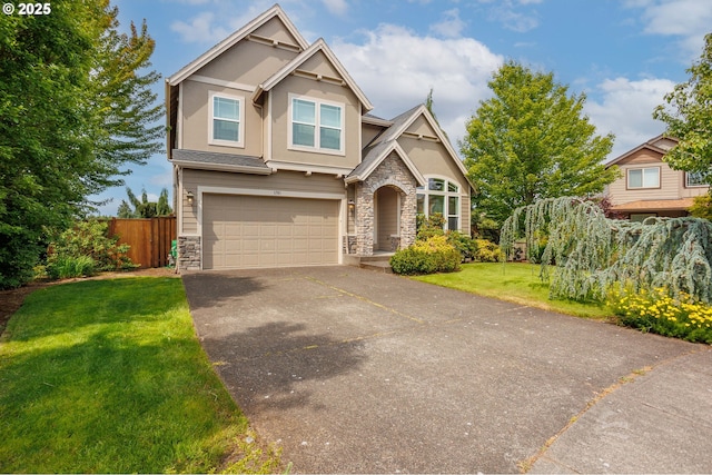1761 S 18th Cir, Ridgefield, WA 98642 - view of front of home featuring stone siding, an attached garage, asphalt driveway, and stucco siding