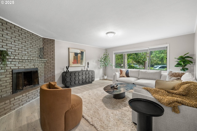 6401 Mcewan Rd, Lake Oswego, OR 97035 - living room featuring wood finished floors, a brick fireplace, and baseboards
