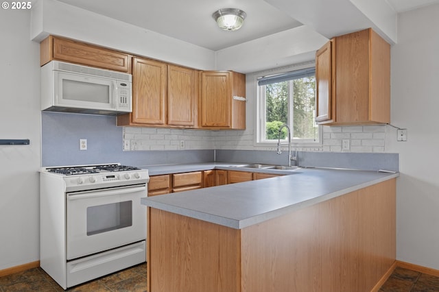 15182 Henrici Rd, Oregon City, OR 97045 - kitchen with white appliances, tasteful backsplash, a peninsula, and light countertops