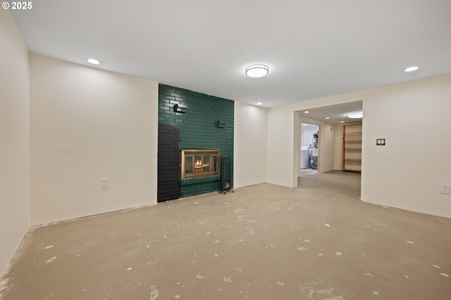 15182 Henrici Rd, Oregon City, OR 97045 - unfurnished living room featuring a fireplace, concrete flooring, and recessed lighting