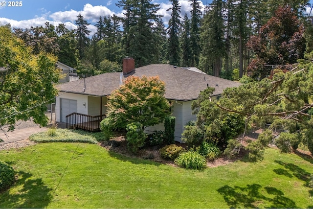 15182 Henrici Rd, Oregon City, OR 97045 - view of front of property with a front yard, a chimney, an attached garage, concrete driveway, and roof with shingles