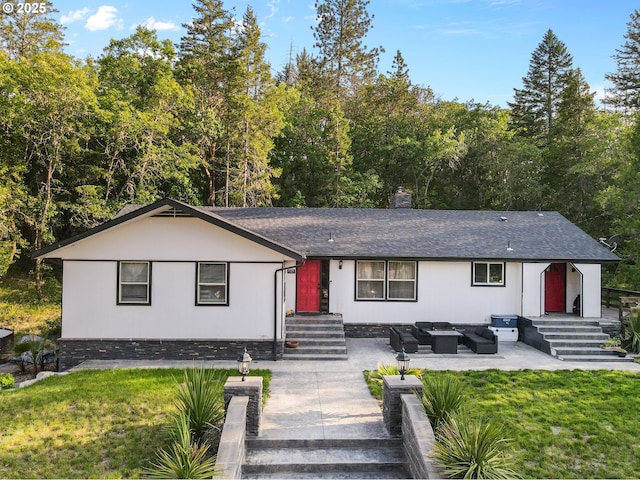 4247 Redwood Hwy, Grants Pass, OR 97527 - view of front of property featuring outdoor lounge area, a shingled roof, a front yard, and a chimney