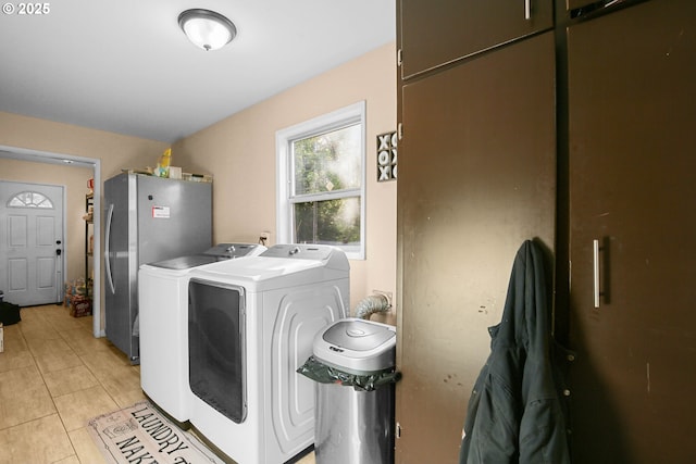 4247 Redwood Hwy, Grants Pass, OR 97527 - laundry room featuring washing machine and dryer and light tile patterned floors