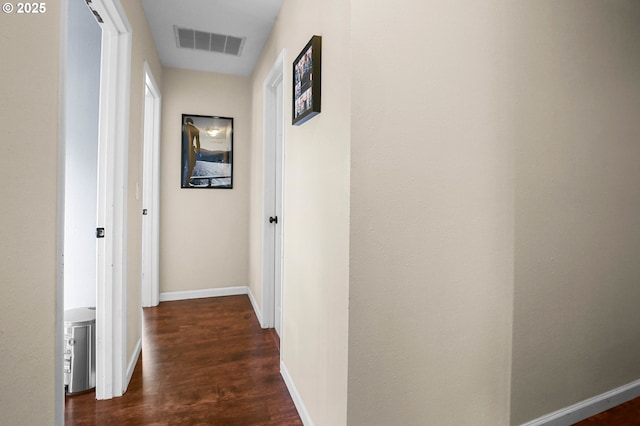 4247 Redwood Hwy, Grants Pass, OR 97527 - hall featuring dark wood-style flooring and baseboards