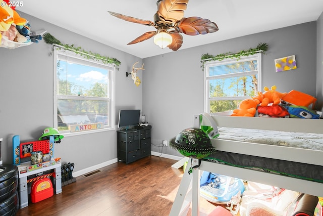 4247 Redwood Hwy, Grants Pass, OR 97527 - bedroom with wood finished floors, baseboards, and a ceiling fan