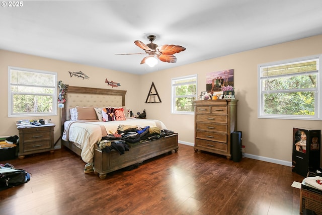4247 Redwood Hwy, Grants Pass, OR 97527 - bedroom with dark wood-style flooring, baseboards, and ceiling fan