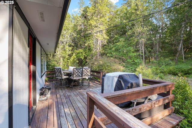 4247 Redwood Hwy, Grants Pass, OR 97527 - deck featuring outdoor dining space and a view of trees