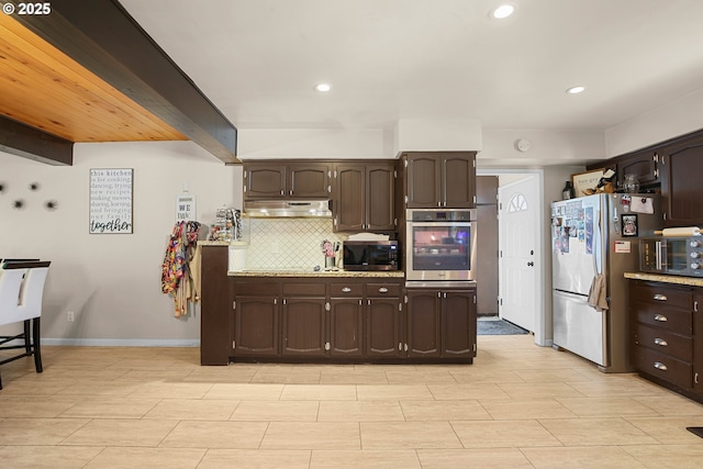 4247 Redwood Hwy, Grants Pass, OR 97527 - kitchen featuring appliances with stainless steel finishes, dark brown cabinetry, under cabinet range hood, decorative backsplash, and recessed lighting