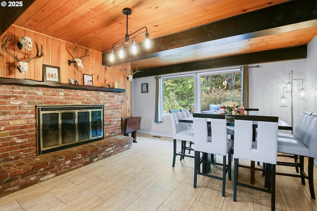 4247 Redwood Hwy, Grants Pass, OR 97527 - dining area with wooden ceiling, a brick fireplace, wood walls, baseboards, and wood finished floors