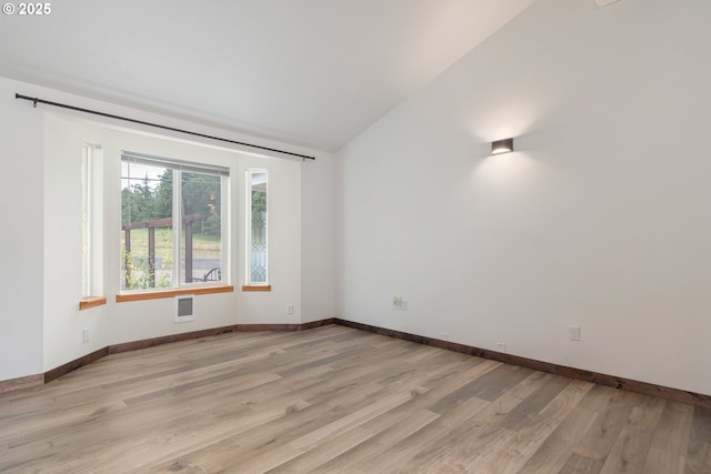 86336 N Modesto Dr, Eugene, OR 97402 - spare room featuring vaulted ceiling and light wood-type flooring