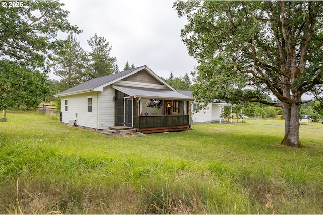 86336 N Modesto Dr, Eugene, OR 97402 - rear view of property with a lawn and a sunroom