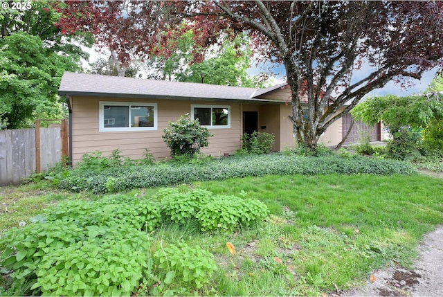 single story home with fence and roof with shingles