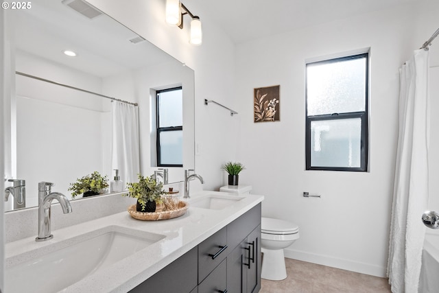 bathroom with vanity, walk in shower, and toilet