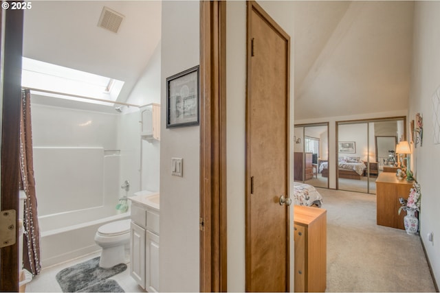 2251 SW Trachsel Dr, Beaverton, OR 97003 - ensuite bathroom featuring vaulted ceiling, a skylight,  shower combination, toilet, and vanity