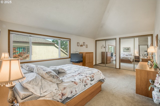 2251 SW Trachsel Dr, Beaverton, OR 97003 - bedroom featuring two closets, carpet, and vaulted ceiling