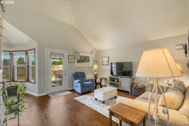 2251 SW Trachsel Dr, Beaverton, OR 97003 - living room with vaulted ceiling, plenty of natural light, dark wood finished floors, and baseboards