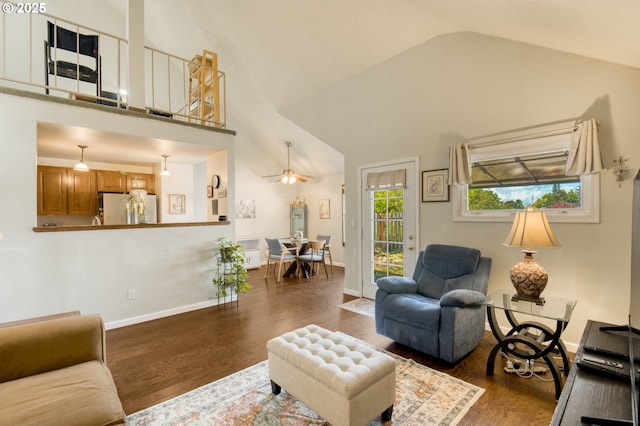 2251 SW Trachsel Dr, Beaverton, OR 97003 - living area featuring dark wood finished floors, high vaulted ceiling, ceiling fan, and baseboards