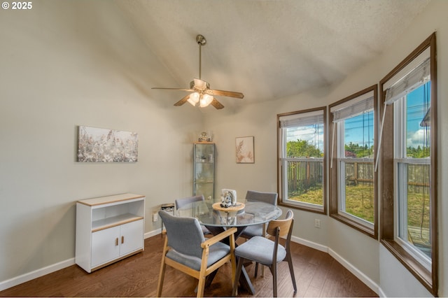 2251 SW Trachsel Dr, Beaverton, OR 97003 - dining room featuring plenty of natural light, dark wood-type flooring, baseboards, a ceiling fan, and lofted ceiling
