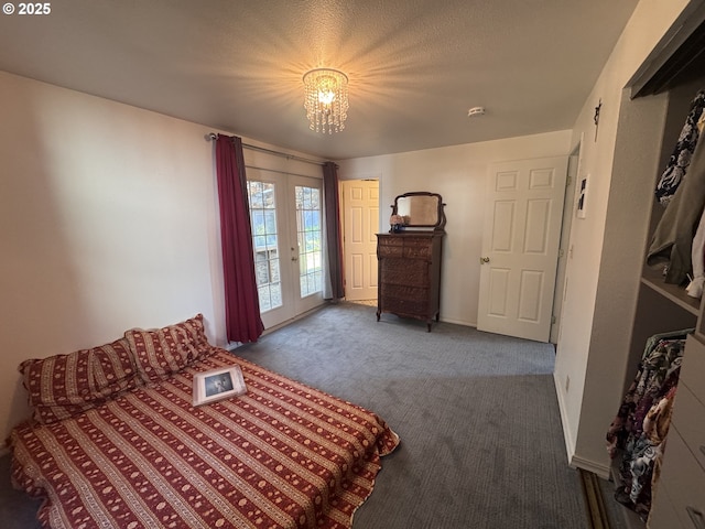 carpeted bedroom with french doors, baseboards, a chandelier, and access to exterior